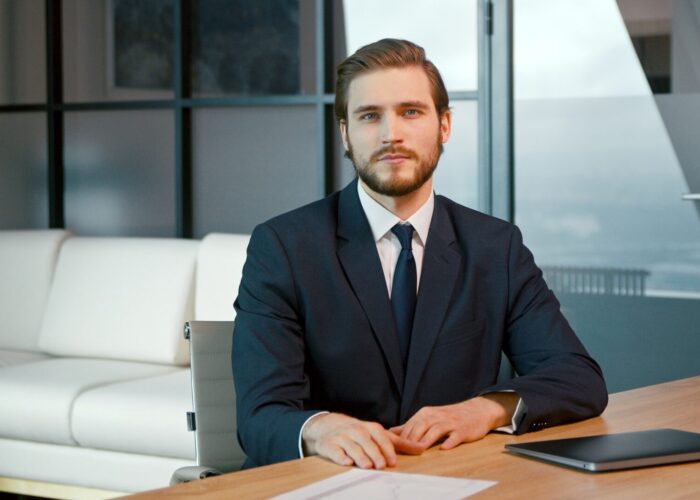 Young man looking at camera consult client